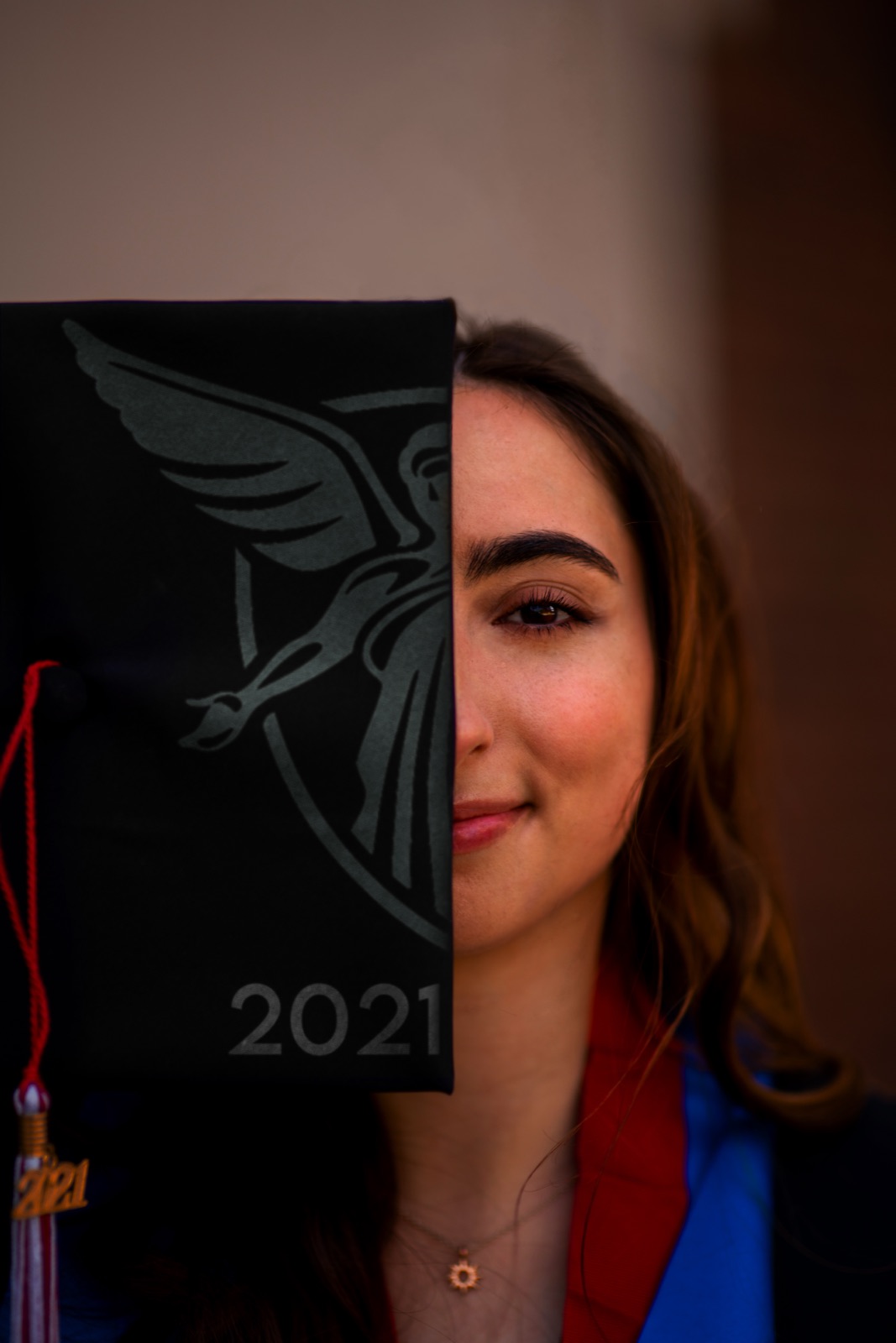 Split portrait of a graduate with the Ball State cardinal