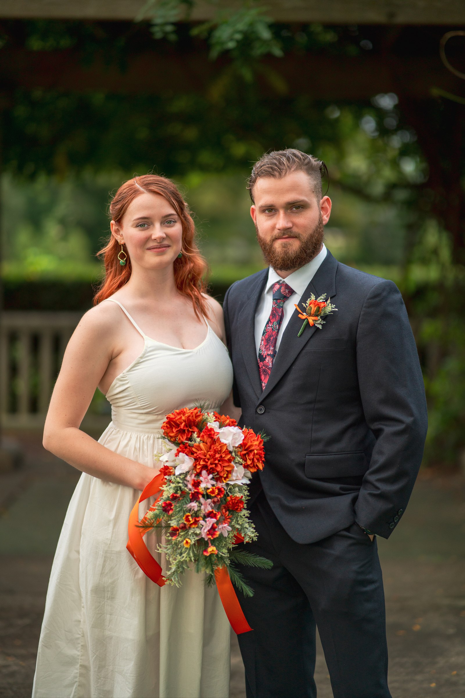 The couple with her red bouquet
