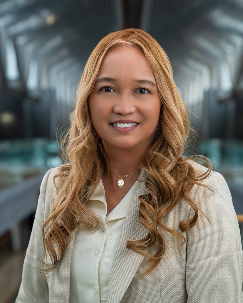 Employee headshot against the atrium, taken by Isaac