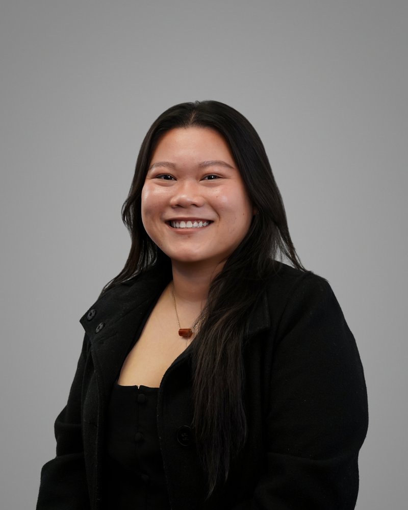 Employee headshot taken in the self-serve Photo Lab studio