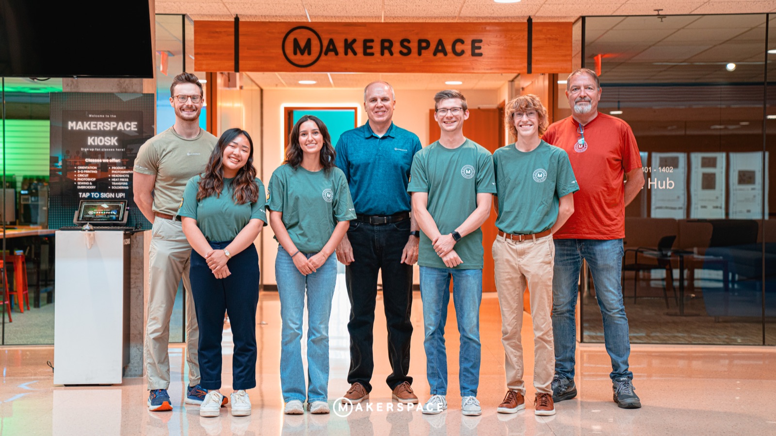 Interns in matching shirts at the Makerspace entrance