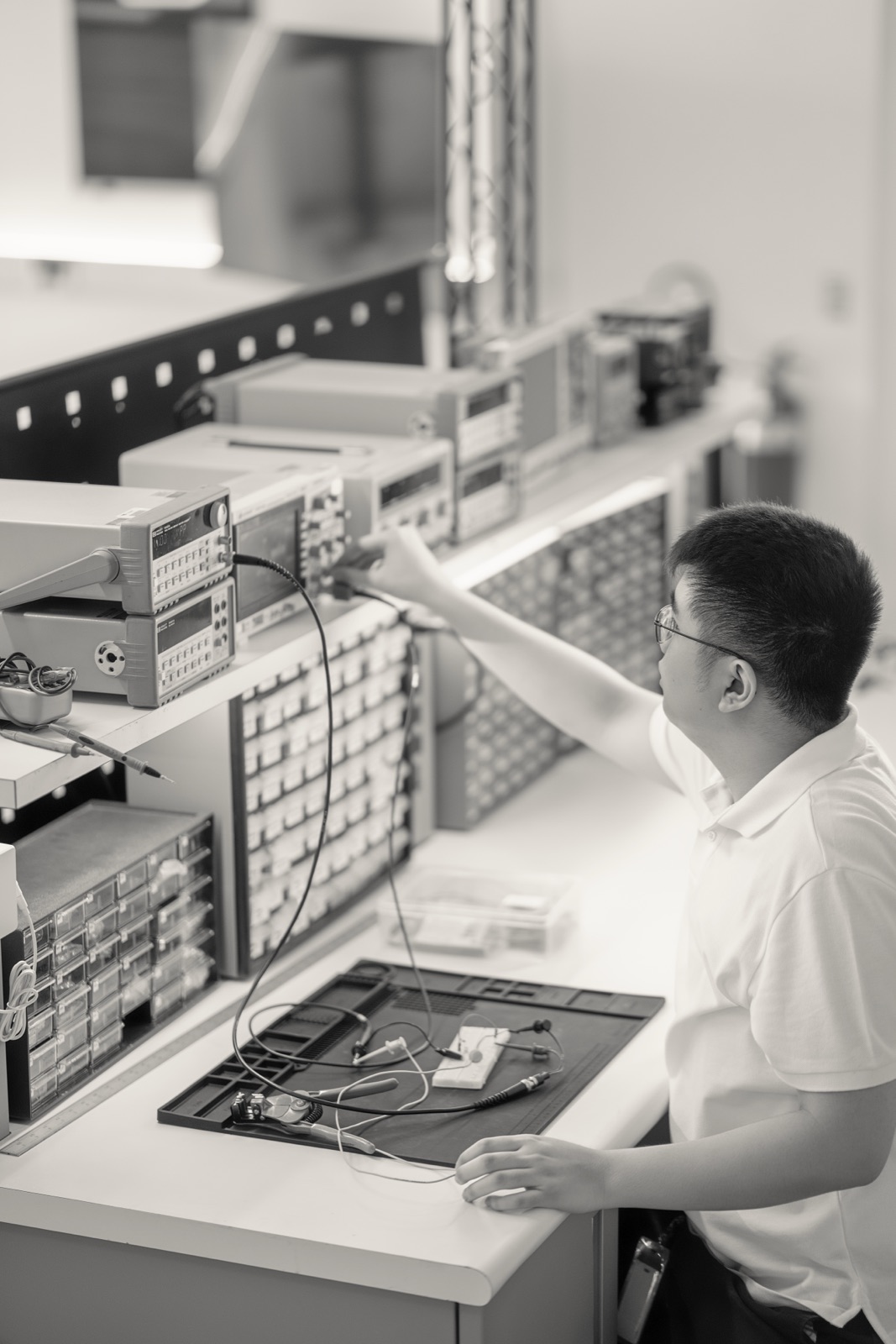 Engineer at a test bench, black and white
