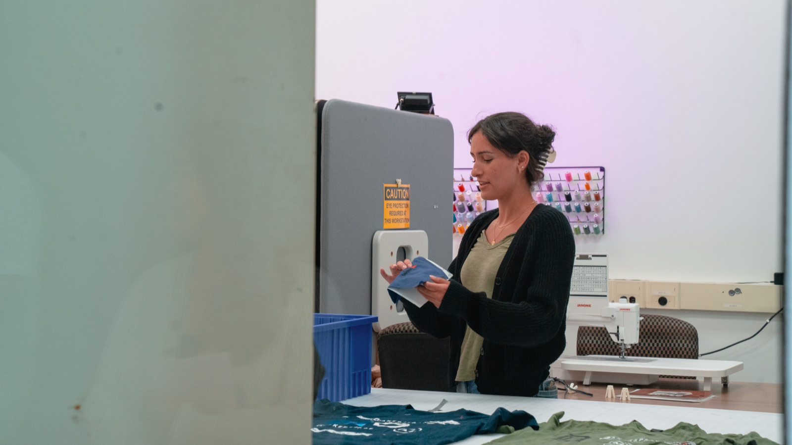 Visitor at a sewing machine in the stitch studio