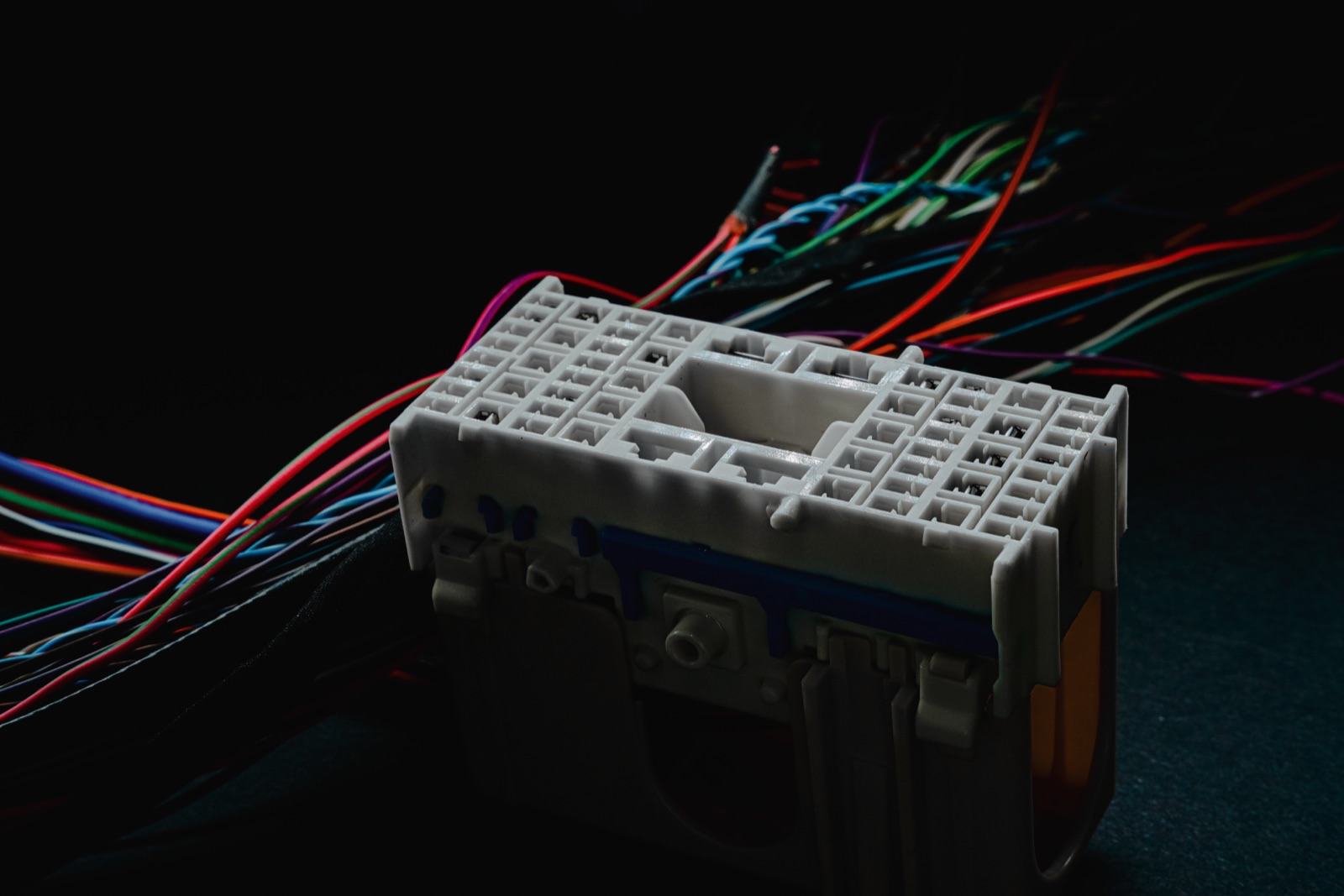 Connector with colored wires on black