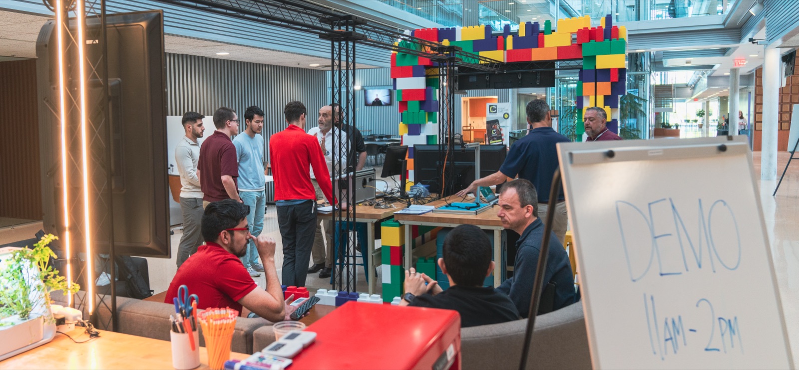 Engineers gathered around a demo table