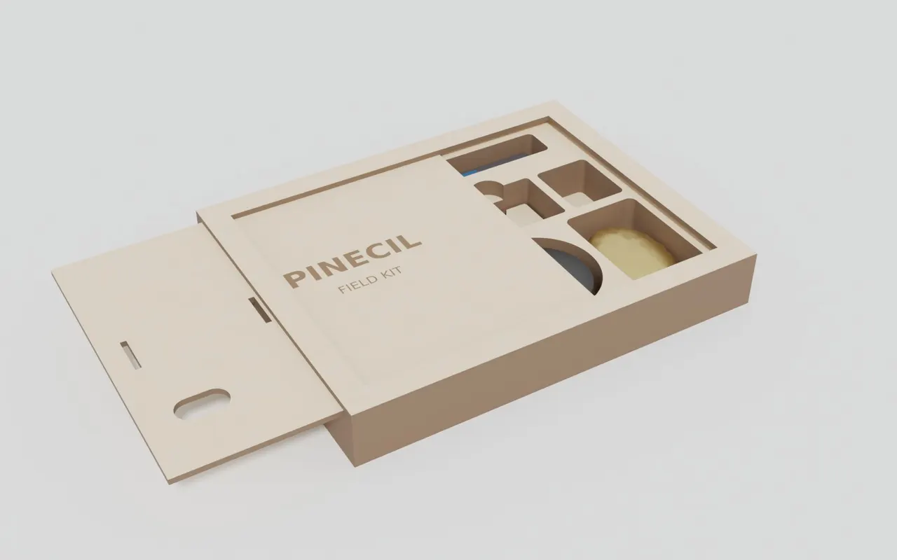 A closed wooden case with PINECIL engraved on the lid
