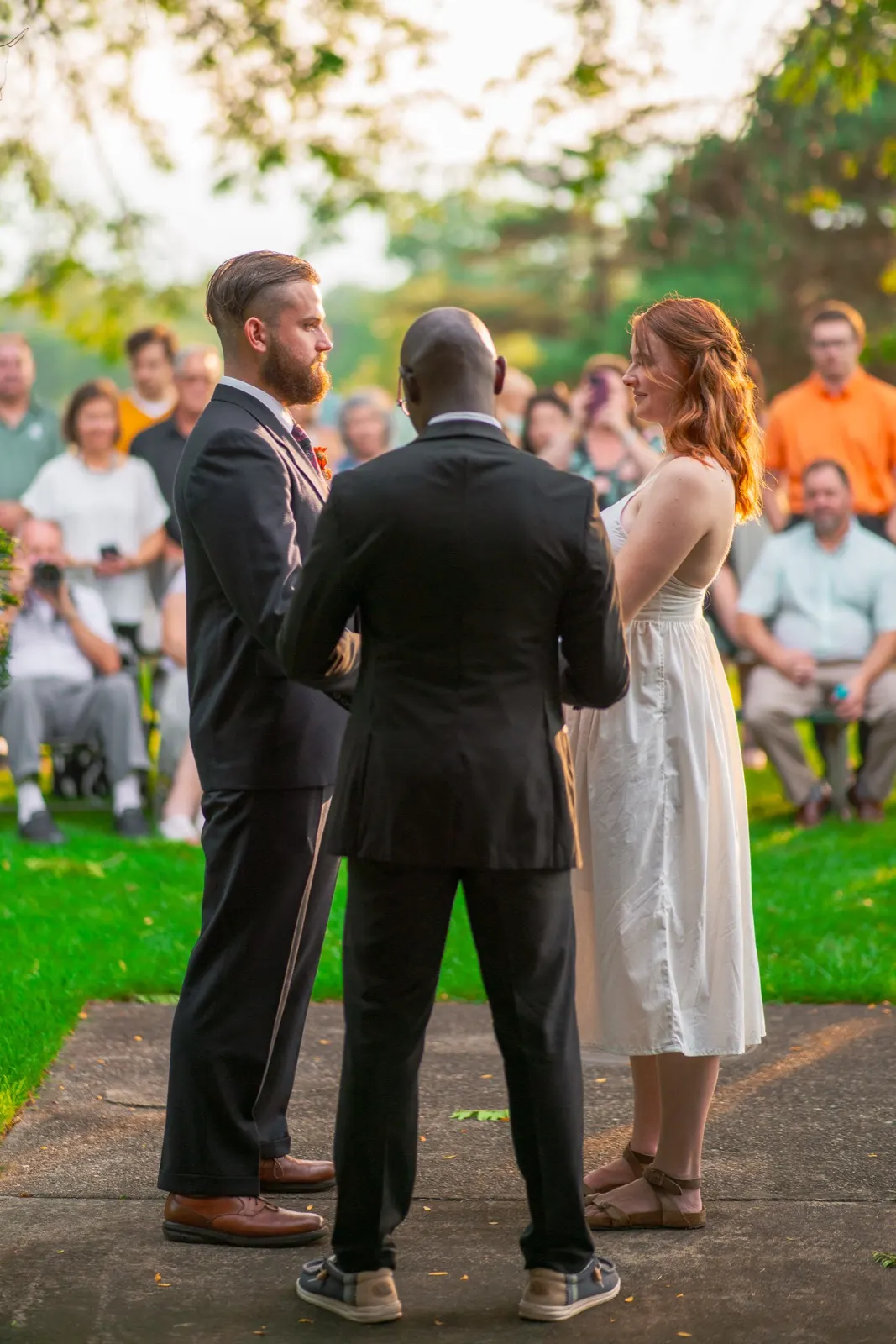Outdoor wedding ceremony seen over the guests